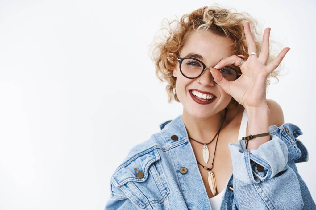 https://www.freepik.com/free-photo/happy-charming-girl-staying-positive-looking-through-okay-gesture-feeling-joyful-carefree-being-optimistic-posing-glasses-denim-jacket-white-background-with-stylish-short-curly-hairstyle_28031108.htm#fromView=search&page=1&position=2&uuid=f2c1ac15-6828-46d7-9023-41358faa4dae&query=glasses